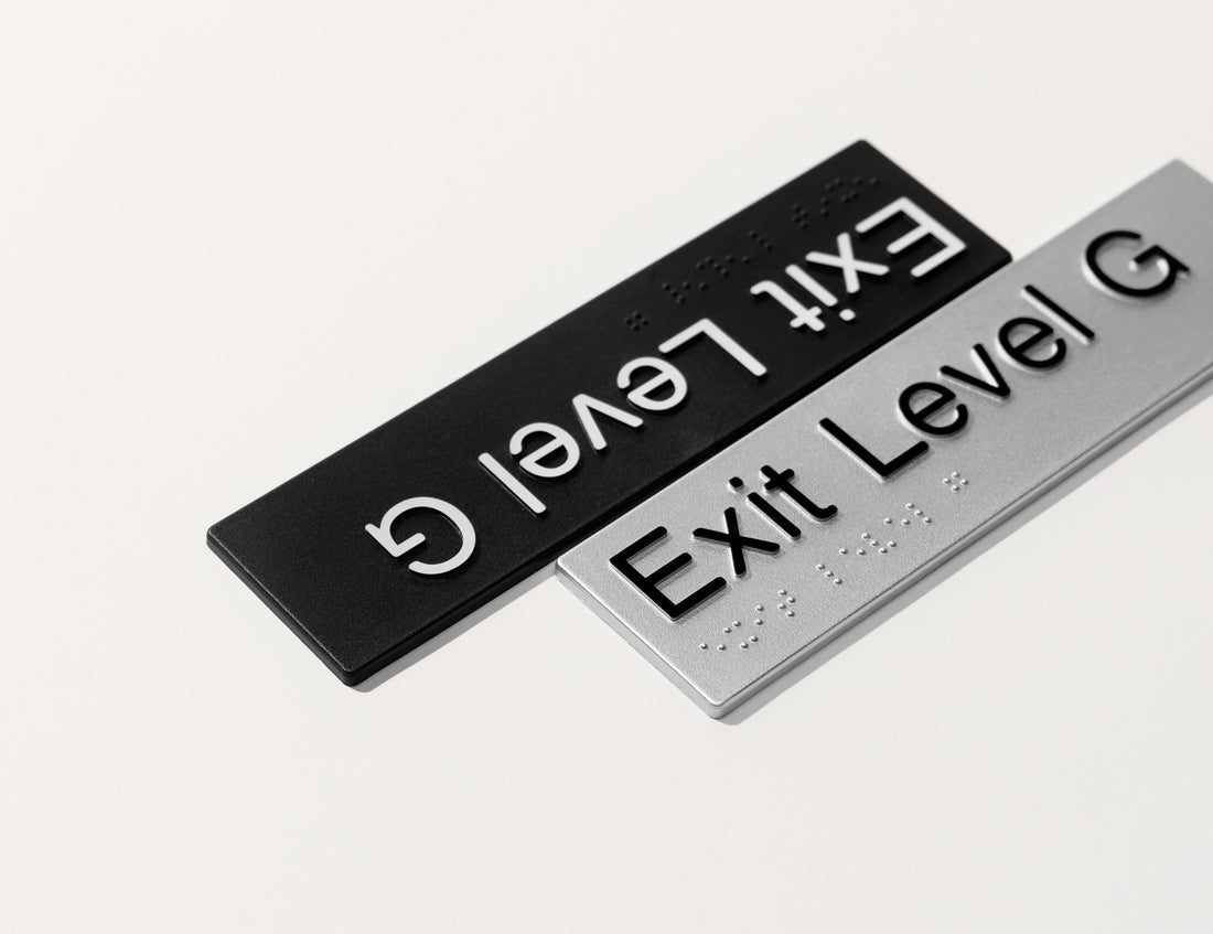 Exit Level Ground - Braille Tactile Sign - Black Plastic